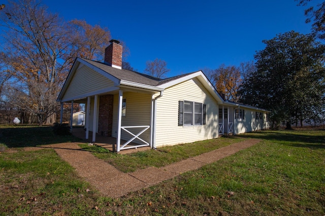 view of property exterior with a lawn