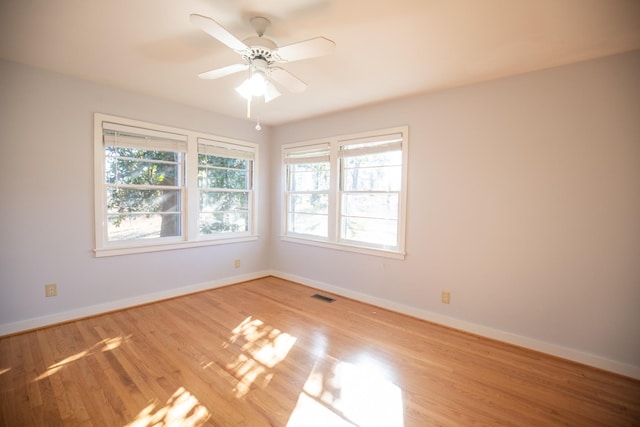 432 Menees Ln, Madison, TN 37115 - empty room featuring healthy amount of natural light, baseboards, wood finished floors, and a ceiling fan