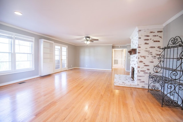 432 Menees Ln, Madison, TN 37115 - unfurnished living room with a ceiling fan, ornamental molding, a fireplace, light wood-style floors, and baseboards