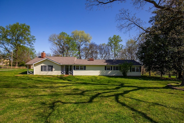 432 Menees Ln, Madison, TN 37115 - back of property featuring a lawn and a chimney