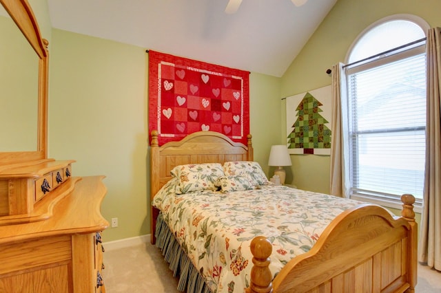 bedroom featuring light carpet, ceiling fan, and lofted ceiling