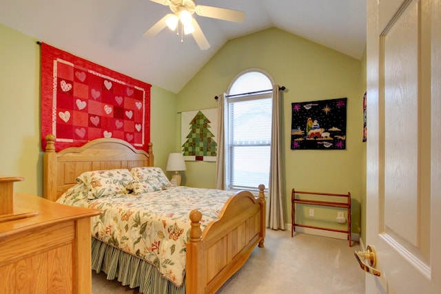 carpeted bedroom with ceiling fan and lofted ceiling