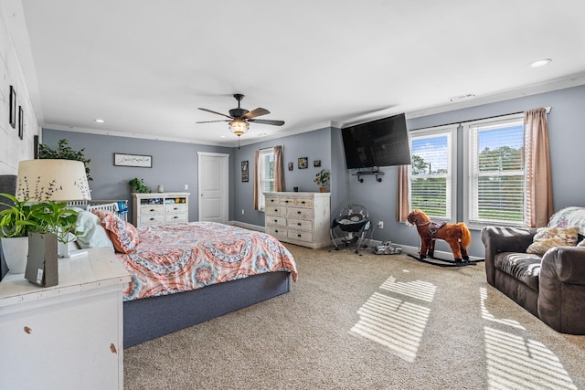 bedroom with ceiling fan, ornamental molding, and carpet flooring