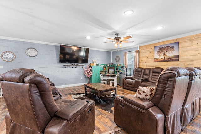 living room with ceiling fan and wood-type flooring