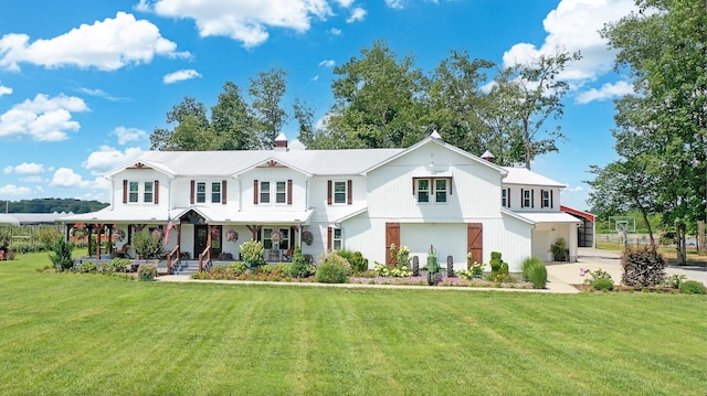 view of front facade with a front yard and covered porch