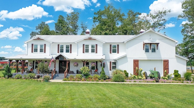 view of front of property with a front yard and covered porch