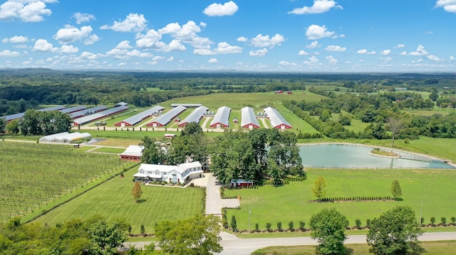 drone / aerial view featuring a rural view and a water view