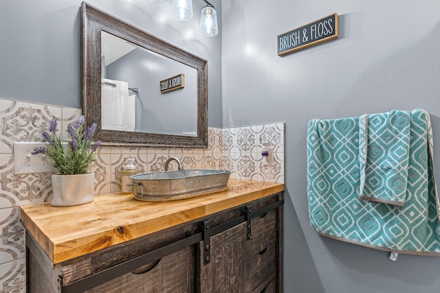 bathroom featuring backsplash and vanity