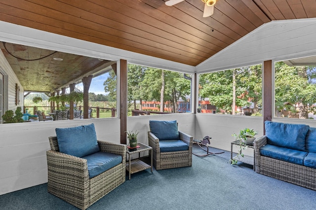 sunroom / solarium featuring ceiling fan, wood ceiling, and vaulted ceiling