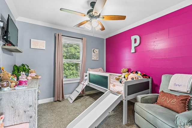 bedroom with ceiling fan, ornamental molding, and carpet