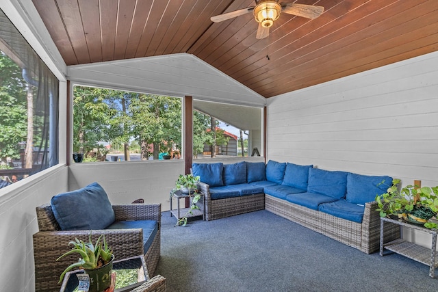 sunroom / solarium featuring lofted ceiling, wooden ceiling, and ceiling fan