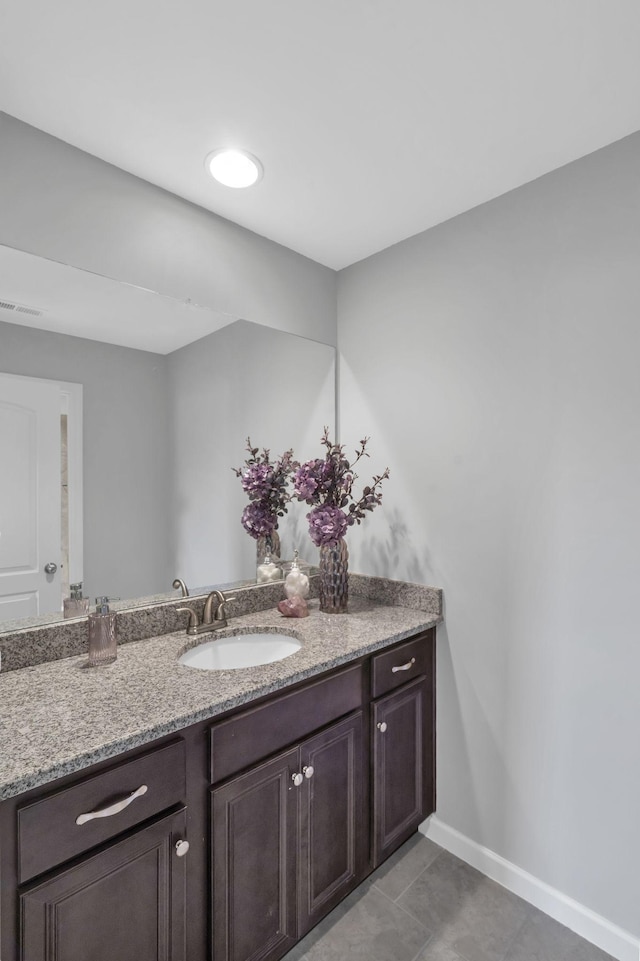 bathroom with tile patterned flooring and vanity