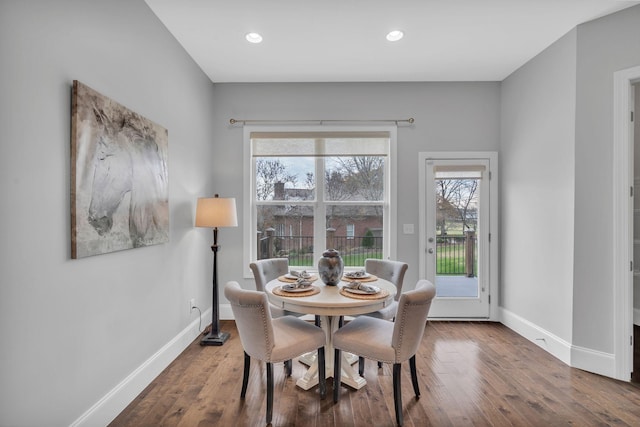 dining space with hardwood / wood-style floors