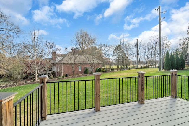 wooden deck featuring a yard