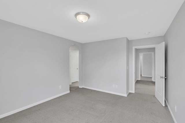 spare room with light colored carpet