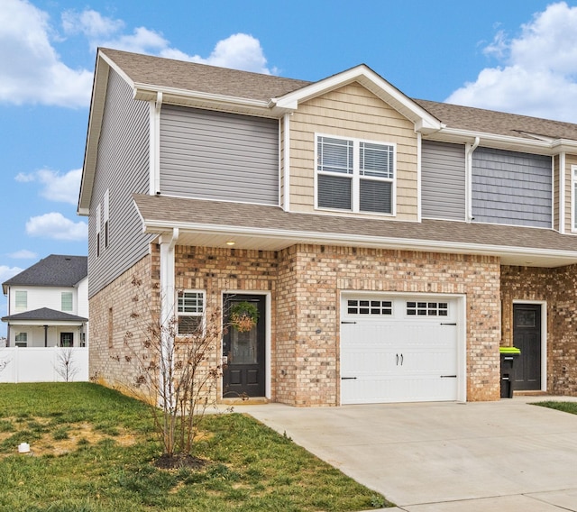 view of front of house featuring a front yard and a garage