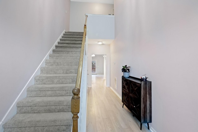 stairway featuring hardwood / wood-style flooring