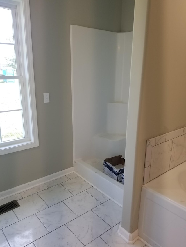 bathroom with a shower