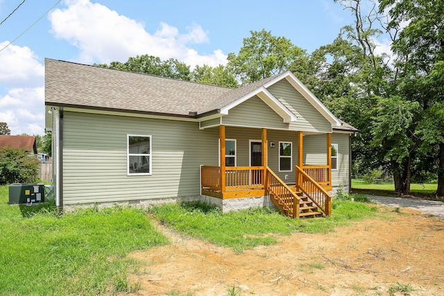 view of front of home featuring covered porch and central AC unit