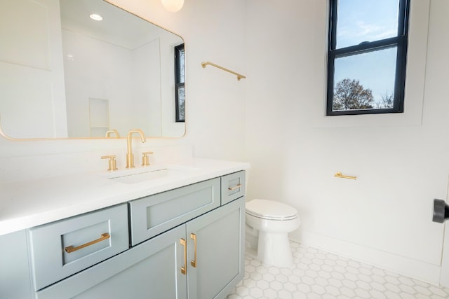 bathroom with vanity and toilet