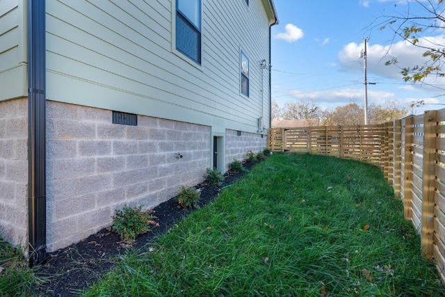 view of home's exterior featuring a yard