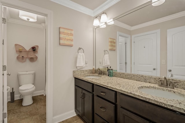 bathroom with tile patterned flooring, vanity, toilet, and crown molding