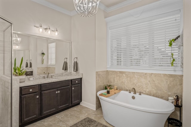 bathroom with a bathing tub, an inviting chandelier, tile patterned flooring, vanity, and ornamental molding