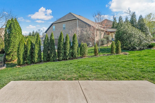 view of side of property featuring a yard