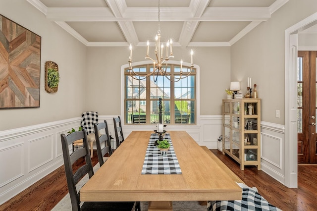 dining room with beam ceiling, crown molding, coffered ceiling, and dark hardwood / wood-style floors