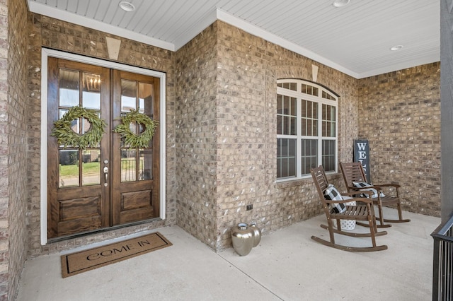 entrance to property featuring french doors and covered porch