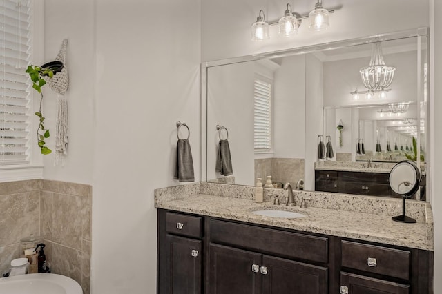 bathroom with vanity and tile walls