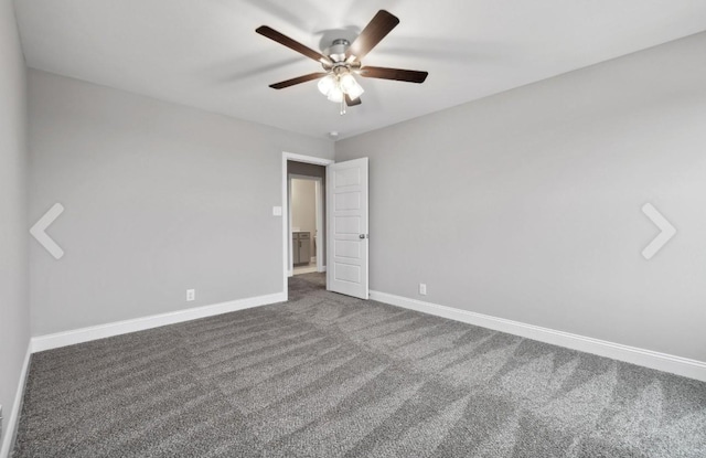 spare room with carpet, a ceiling fan, and baseboards