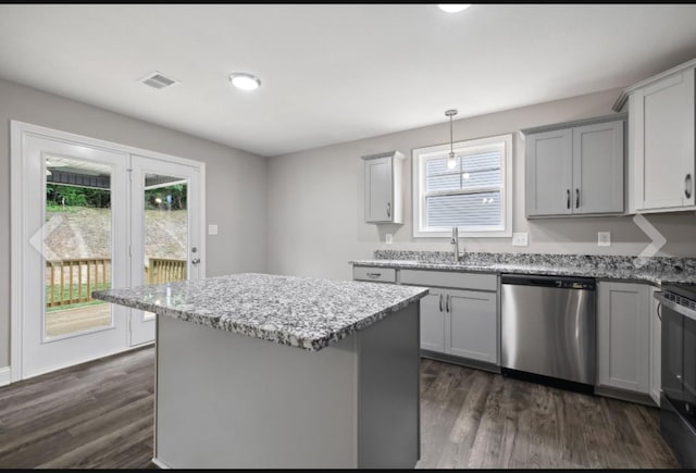 kitchen with visible vents, stainless steel dishwasher, dark wood-style flooring, and gray cabinets