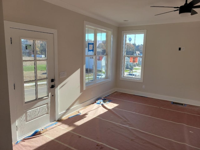 doorway to outside with ceiling fan