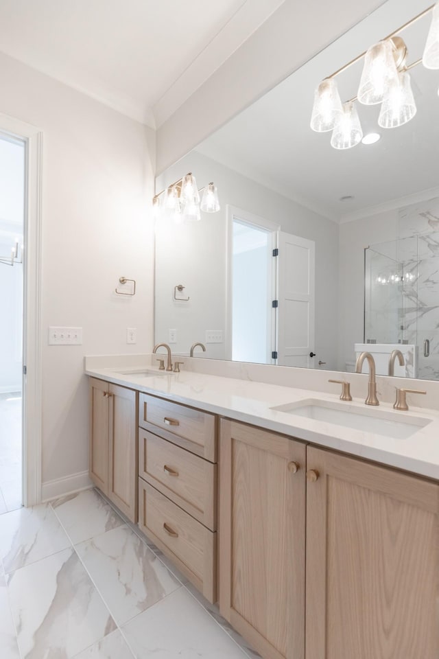 full bath featuring a marble finish shower, marble finish floor, ornamental molding, and a sink