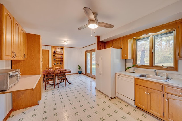 kitchen with white appliances, ceiling fan, and sink