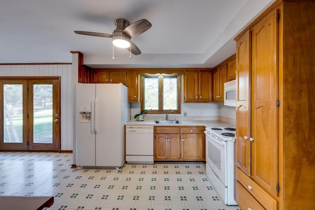 kitchen featuring french doors, white appliances, ceiling fan, crown molding, and sink