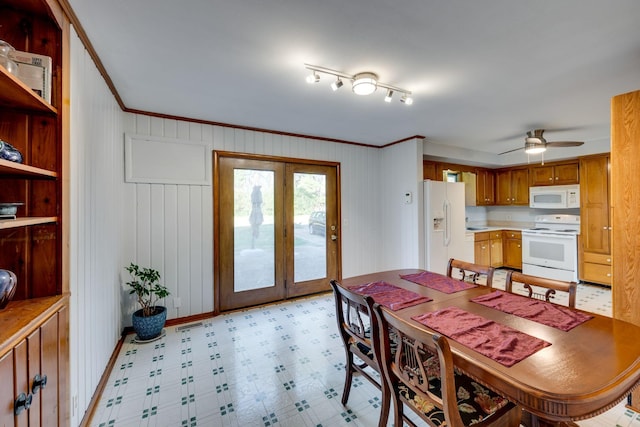 dining space featuring crown molding, french doors, and ceiling fan