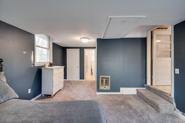 carpeted bedroom featuring heating unit