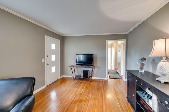 living room featuring light wood-type flooring and ornamental molding