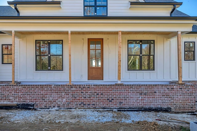 doorway to property with a porch