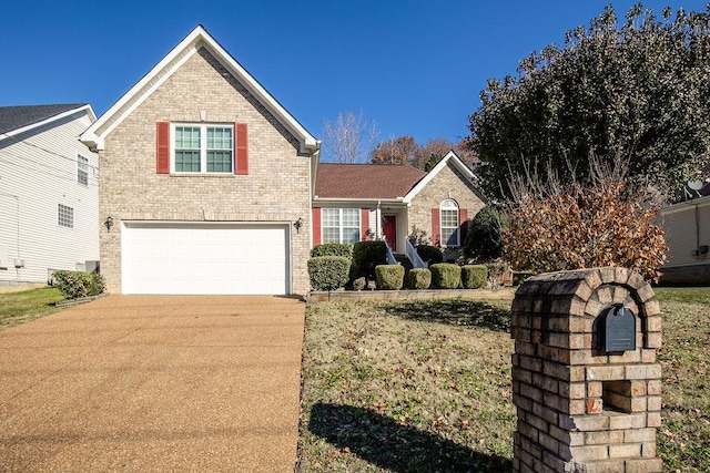 view of property with a front yard and a garage