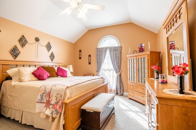 carpeted bedroom featuring ceiling fan and lofted ceiling