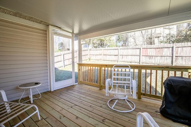 wooden terrace with a grill