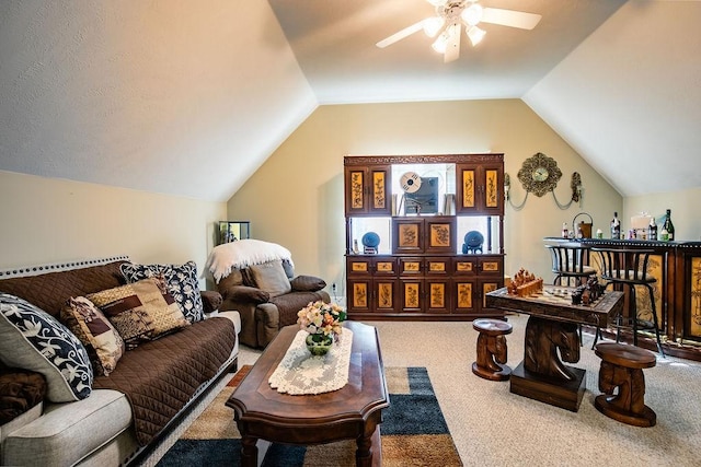 interior space with carpet flooring, ceiling fan, and vaulted ceiling