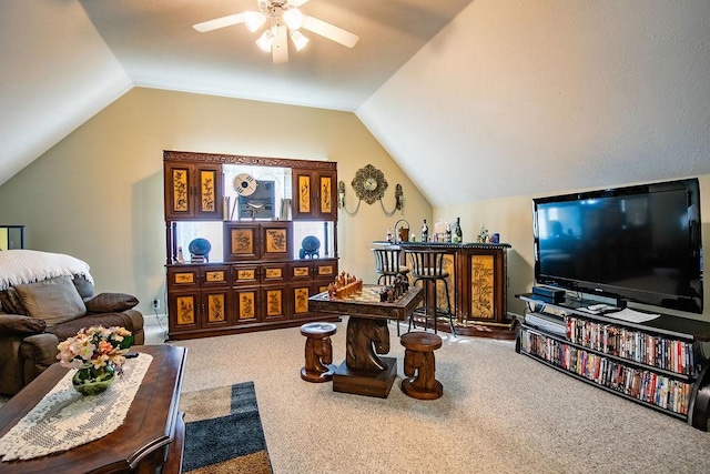 carpeted living room with vaulted ceiling and ceiling fan