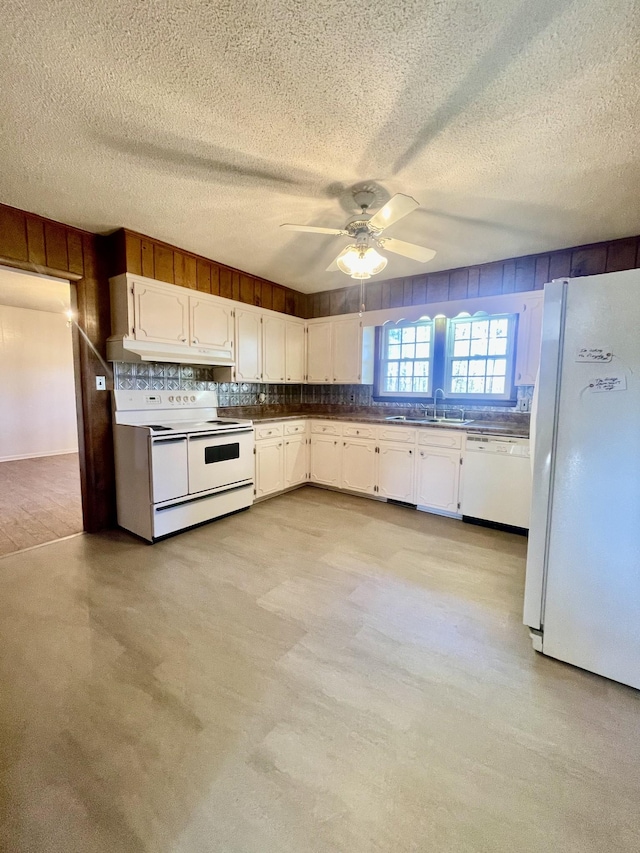 kitchen with a textured ceiling, white appliances, ceiling fan, sink, and white cabinets