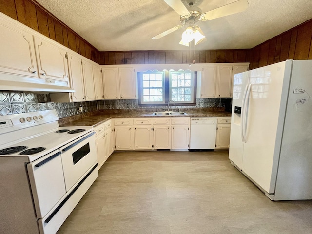 kitchen with backsplash, a textured ceiling, white appliances, sink, and white cabinets