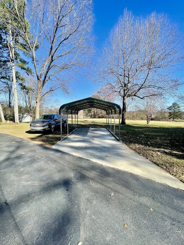 view of parking / parking lot with a carport