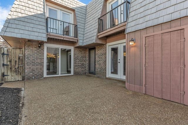 rear view of house featuring a balcony